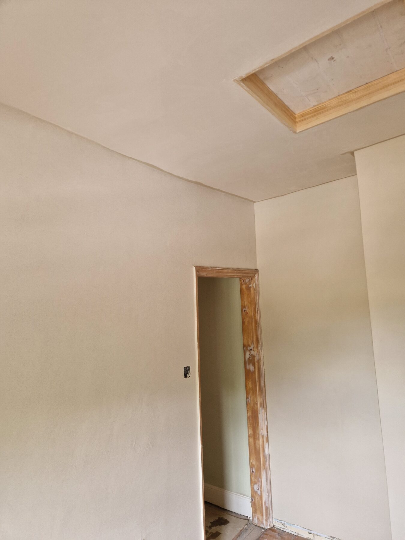 Smooth modern plaster finish to walls and ceiling in a Norfolk home